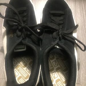 Women’s black suede Puma classic sneakers